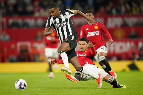 Alexander Isak challenges for the ball with Casemiro